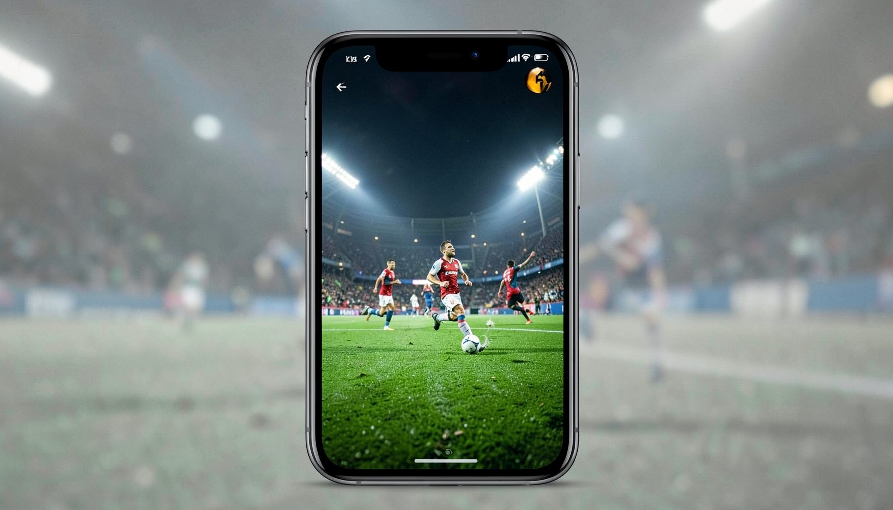 A phone screen displaying a live sports stream with green turf and players in motion under bright floodlights