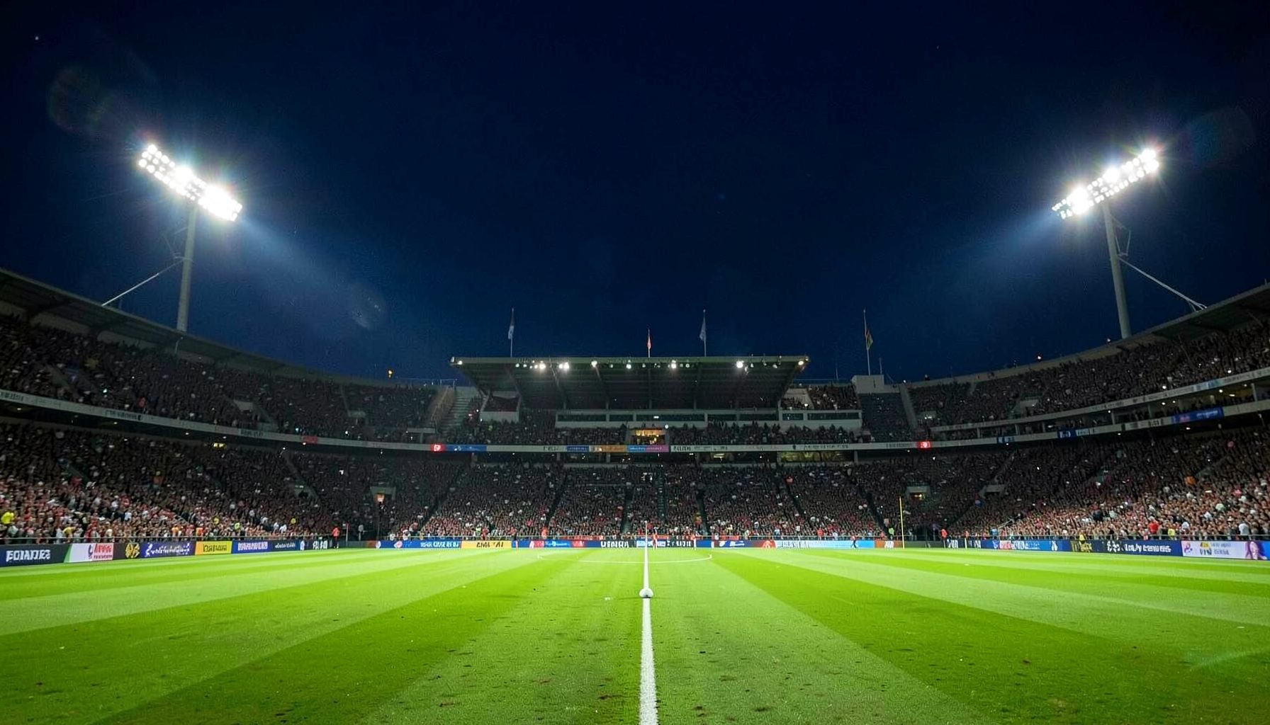 Cricket stadium under floodlights with vibrant green field and deep navy sky, capturing live match energy